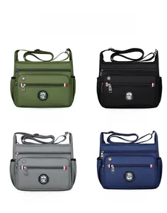 Four nylon crossbody bags in green, black, grey and blue with multiple zipper compartments