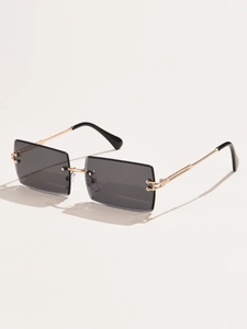 Detail of rimless square sunglasses with grey gradient lenses and slim gold metal temples