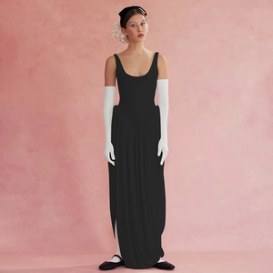 Detail of elegant backless black maxi dress with side split and vintage studio styling