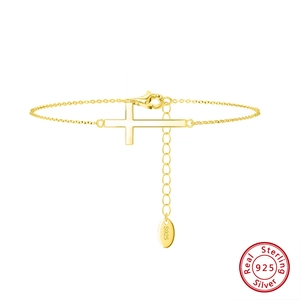 Minimalist S925 sterling silver cross bracelet with polished gold finish and adjustable chain