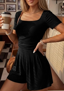 Detail of black ribbed square neck short sleeve top and high waist shorts with textures