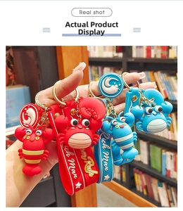 Close-up of colorful lobster and crab silicone keychains with Rich Man wrist straps