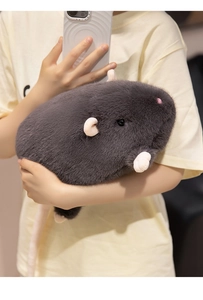 Detail of plush grey mouse doll being held, showing soft faux fur and long pink tail