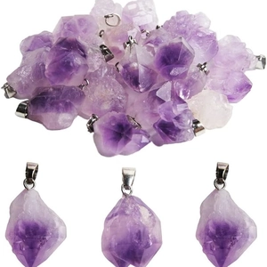 Natural raw amethyst cluster pendant with silver metal bail on a clean white background