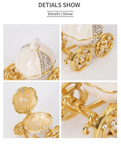 Macro details of golden pumpkin carriage jewelry box with enamel and rhinestones
