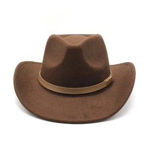 Close-up of deep brown wool felt cowboy hat featuring light brown leather band and gold buckle