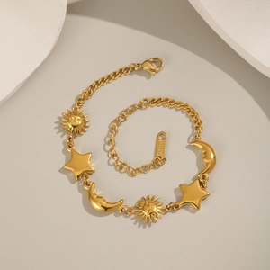 18K gold plated stainless steel bracelet with sun, moon and star charms in spiral layout