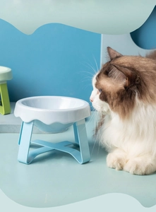 Elevated ceramic pet bowl with blue stand and white wavy edge for cats and small dogs