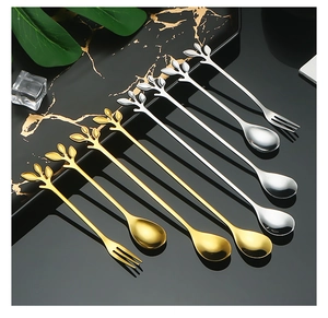 Detail of 8-piece gold and silver leaf-shaped stainless steel dessert spoons and fruit forks
