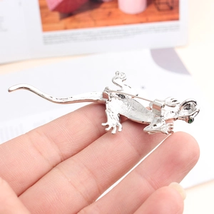 Silver gecko brooch pin with green eyes and detailed textured engraving for women
