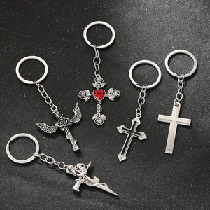 Gothic silver metal keychains with cross and rose designs featuring red heart gemstone