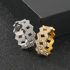 Detail of hip hop Cuban link rings with rhinestones in gold and silver finish