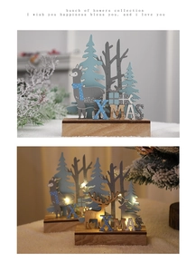 Close-up of wooden Christmas reindeer decor with LED lights and festive XMAS lettering