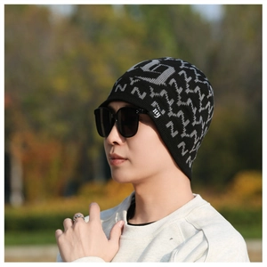 Close-up of knit winter beanie featuring gray N patterns and white NY embroidery detail