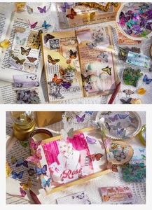 Detail showing decorative butterfly stickers on vintage journal and elegant photo frame
