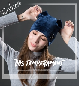 Detail of navy velvet cat ear hat with black lace bow and sparkling silver rhinestones