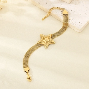 Close-up of golden mesh chain bracelet with a 3D star pendant and lobster clasp