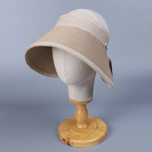 Close-up of wide brim sun hat showing woven texture and adjustable elastic back strap
