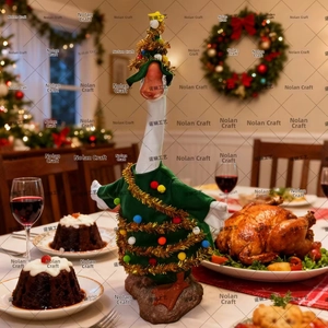 Detailed view of goose doll in green Christmas tree outfit on a festive dinner table