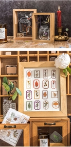 Macro shot of vintage botanical PET stickers with flower and leaf motifs for DIY scrapbooking