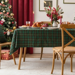 Christmas green plaid table runner and matching pillow set in a cozy festive scene