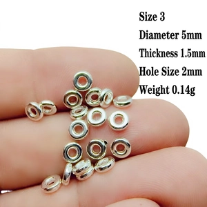 Macro detail of 5mm silver alloy spacer beads for DIY jewelry making with dimensions