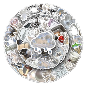 Close-up of liquid metal silver stickers with heart, cloud, and retro 3D shapes