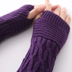 Detailed view of purple cable knit fingerless gloves showing arm warmers texture