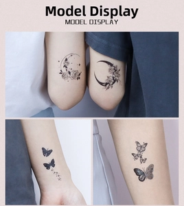 Detail shots of waterproof butterfly and celestial temporary tattoo stickers on arms