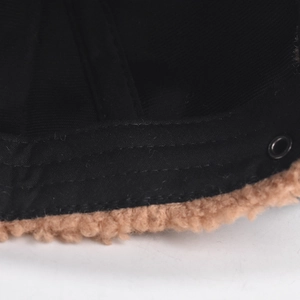Close-up of children's winter baseball cap showing sherpa fleece trim and stitching