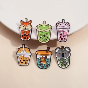 Cartoon animal enamel pins collection featuring frog and fox with bubble tea designs