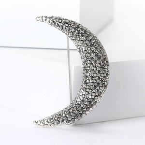 Vintage silver crescent moon brooch with dark grey rhinestones for suit or coat