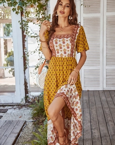 Detail view of the floral bohemian maxi dress featuring a square neck and high waistline