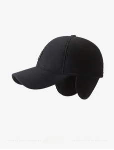 Detail of warm winter baseball cap with earflaps and textured wool blend fabric