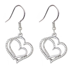 Detail of silver double heart drop earrings with crystals on a white background