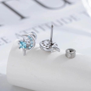 Star and moon cartilage stud earrings with blue cubic zirconia in silver steel