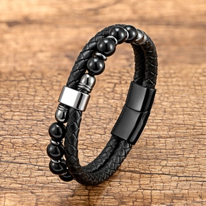 Men's double-layer braided leather bracelet with black beads and magnetic buckle on wood