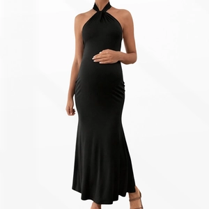Detailed front view of black maternity maxi dress featuring halter neck and slim fit design