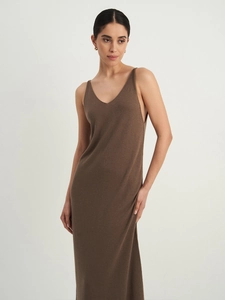 Detail view of dark brown knitted long dress with soft ribbed texture and deep V-neckline
