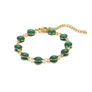 Gold-plated stainless steel bracelet featuring green glitter oval charms with lobster clasp