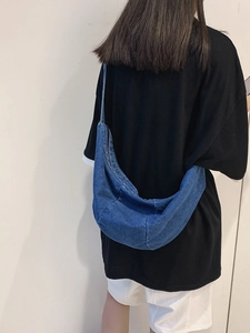 Large blue denim crescent crossbody bag with minimalist street style design for men and women