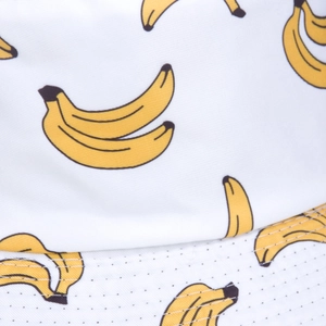 Chapeau bob blanc avec motif bananes en toile arborant des surpiqûres parallèles
