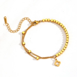 Double-layered gold stainless steel chain bracelet with square beads and flower pendant