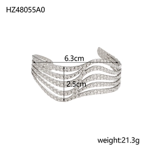 Detailed view of silver hollow wave bangle with dimensions 6.3cm width and 21.3g weight