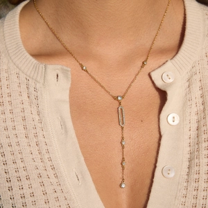 18k gold plated titanium Y-shaped drop necklace featuring a crystal pavé oval pendant