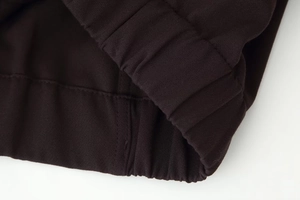Detailed close-up of high-quality twill fabric texture and durable elastic cuff stitching
