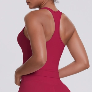 Detail of dark red racerback sports bra showing ergonomic fit and high-stretch fabric