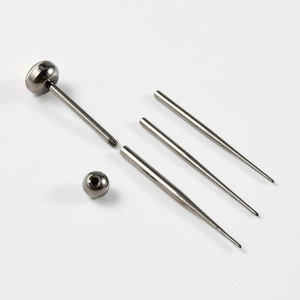 Detailed set of G23 titanium piercing jewelry with clear gems and steel insertion pins