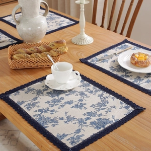 Blue floral cotton linen placemats with crochet lace edges for dining table decor
