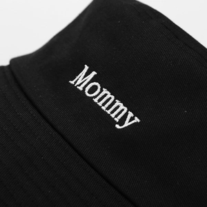 Fashionable black cotton bucket hat with white Mommy embroidery detail on the front